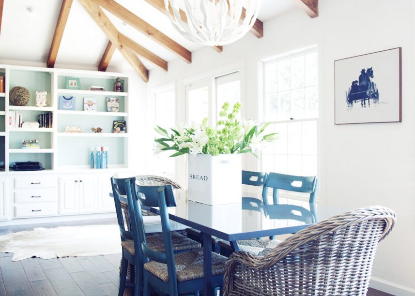 Light And Bright, Pitched Ceilings, Exposed Beams, Wicker Chairs, Blue Dining Chairs, Unique Pendent Light