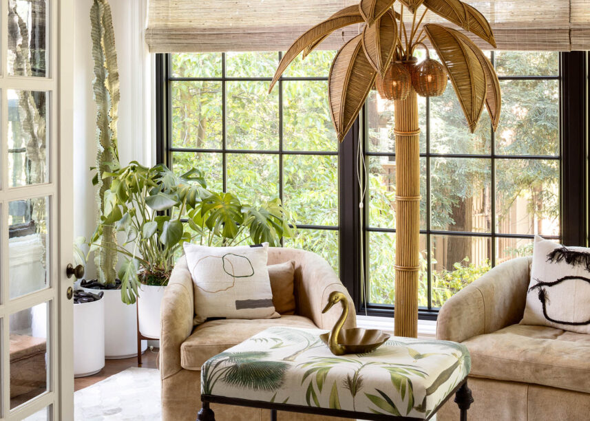 sun room, palm tree lamp, cowhide rug, palm leaf ottoman
